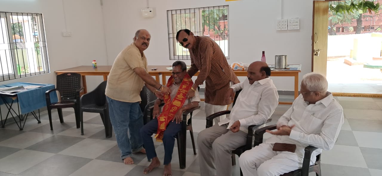 Ravi Kumar Garu and Yadaiah garu honouring Maruthi ram Garu for singing songs.jpeg